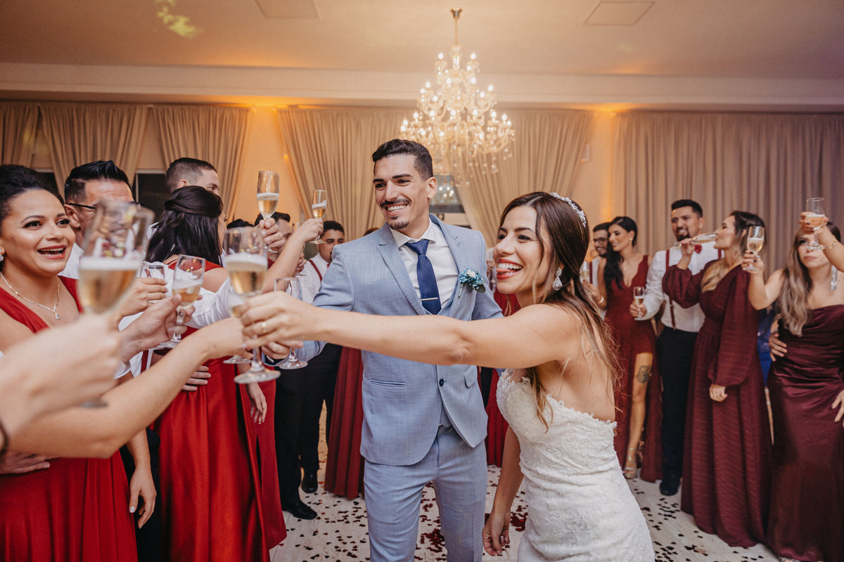 Newlyweds celebrating with close friends at their wedding reception.