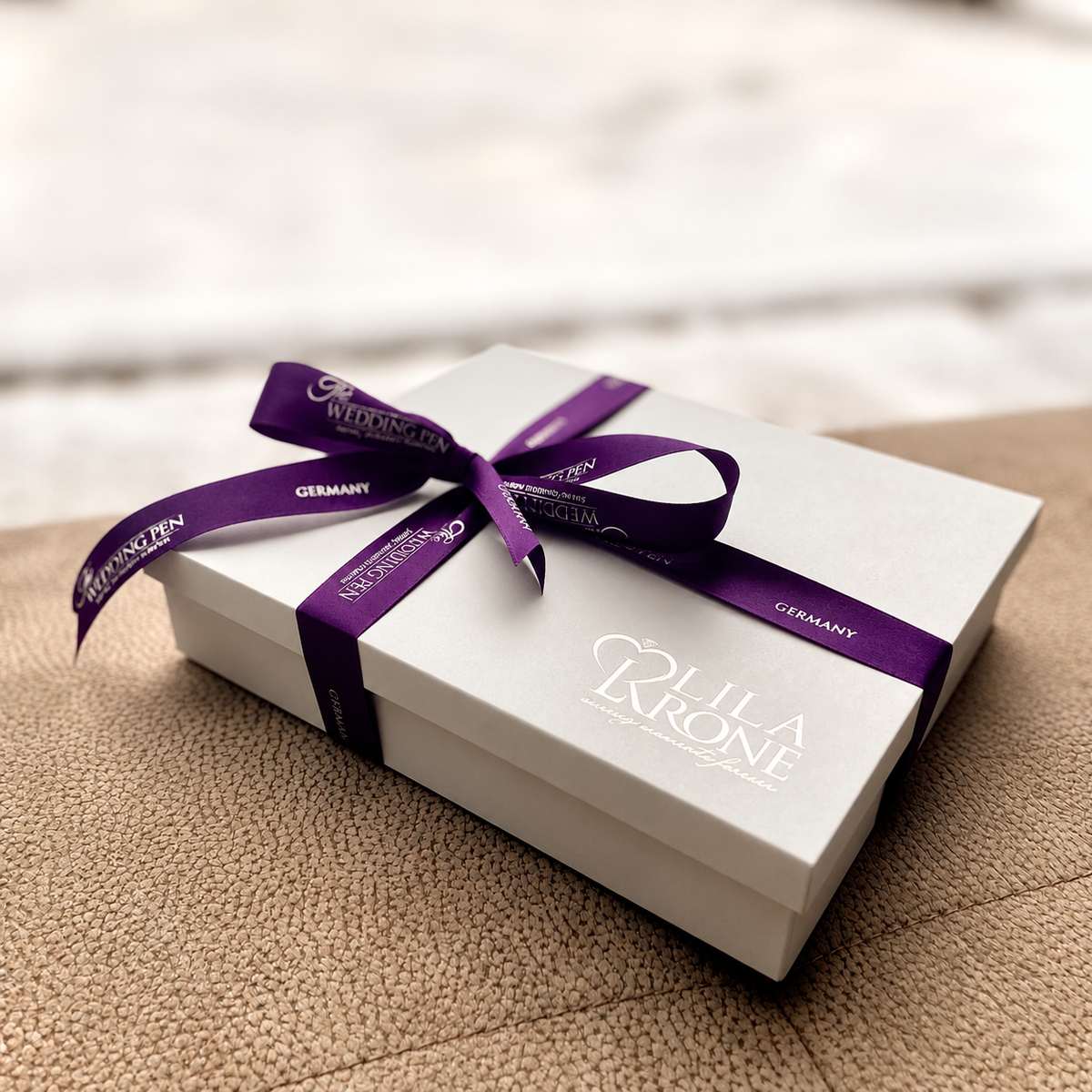 Wedding Pen carefully prepared and gift wrapped in Memory Box, resting on a textured beige surface.