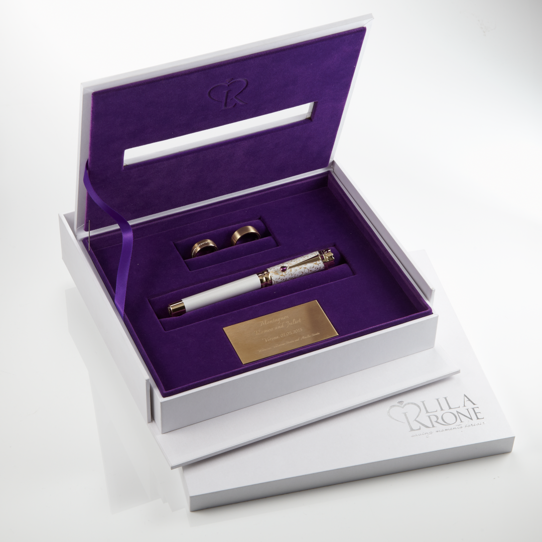 Wedding Pen Legacy Edition in an open Memory Box with rings and engraved plaque.